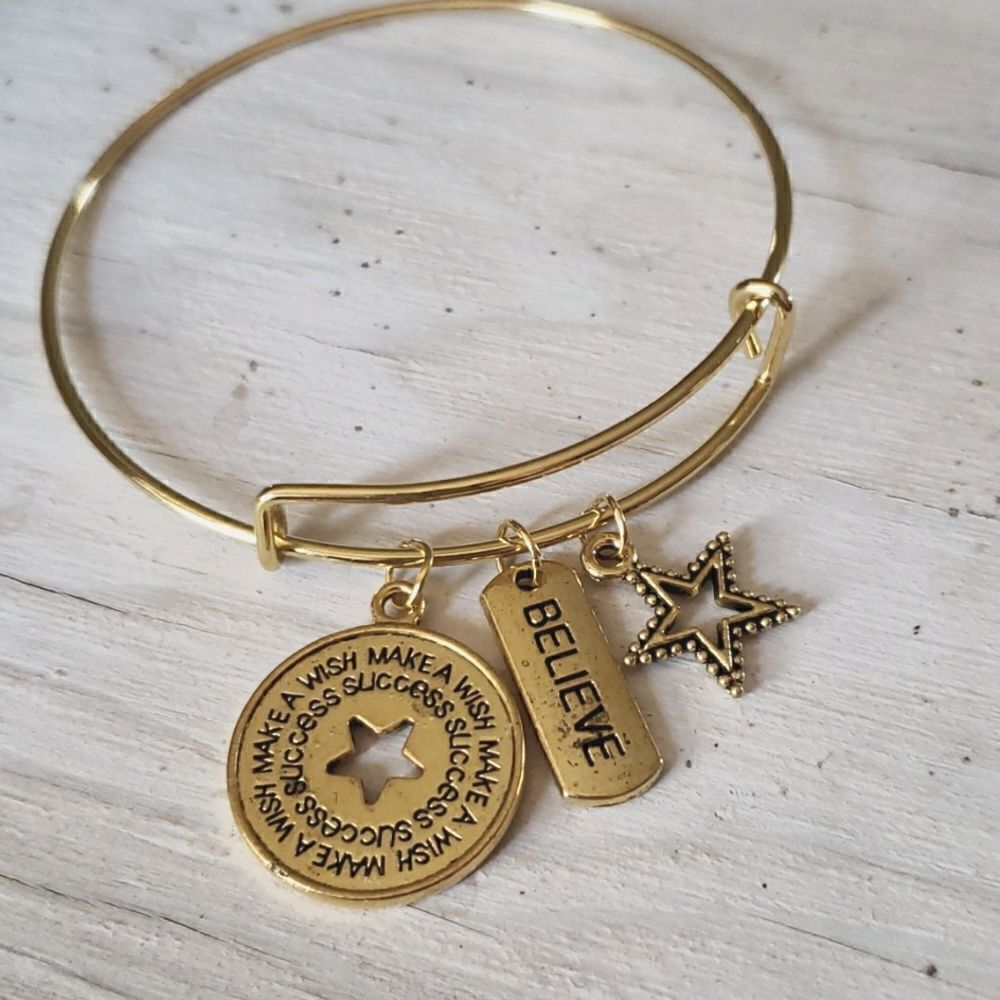 Bracelets by Sandra gold tone adjustable, Believe